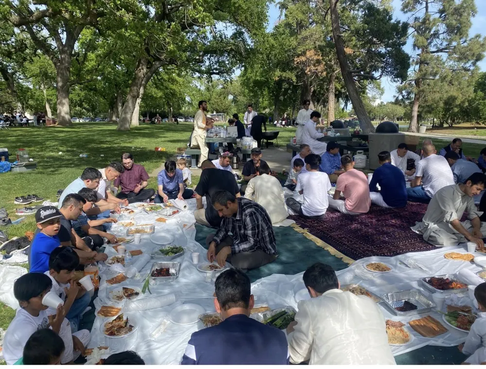 Fathers and children sharing a meal at a community gathering
